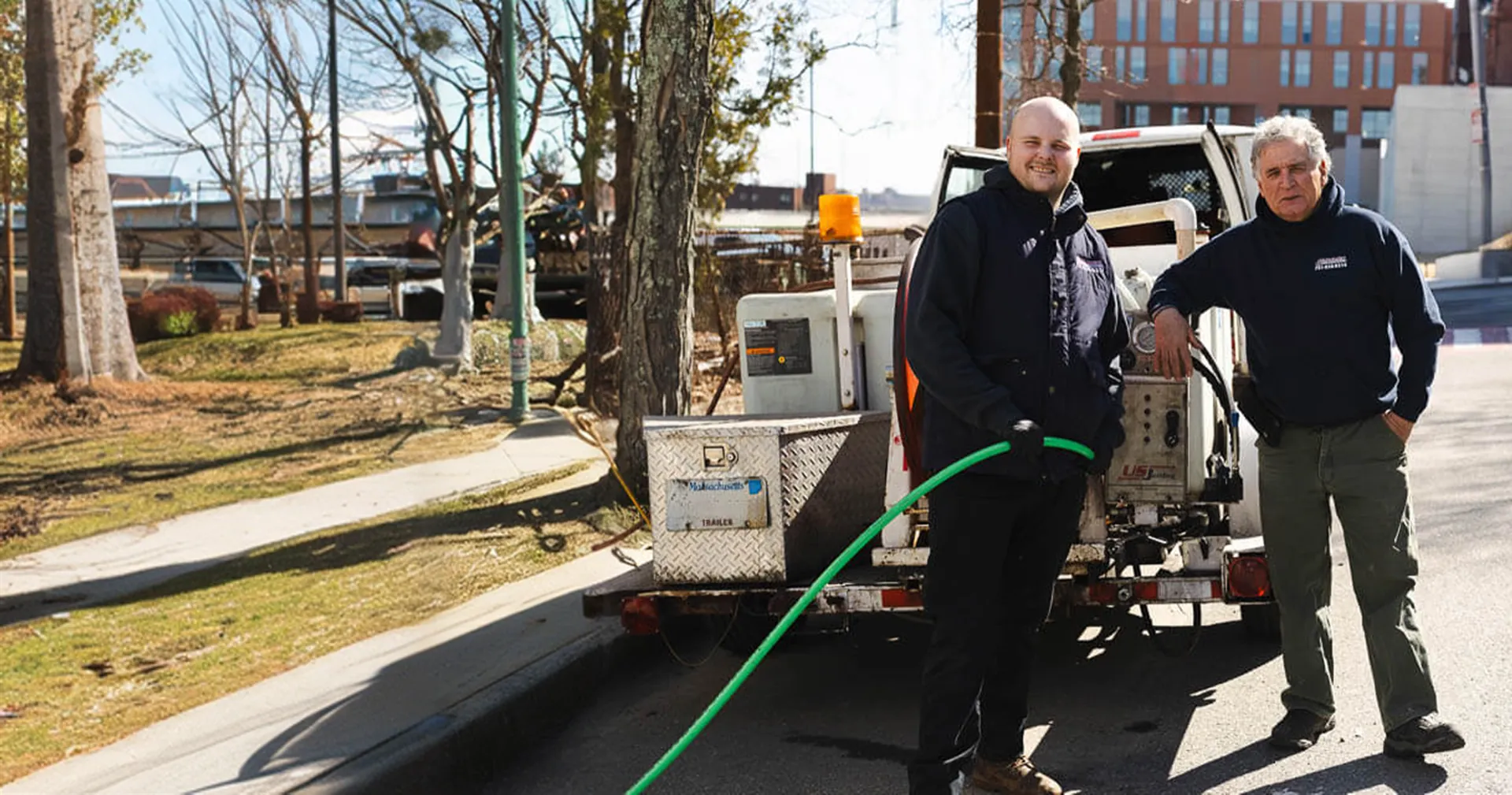 Snake-It-Away team with their service vehicle in Boston